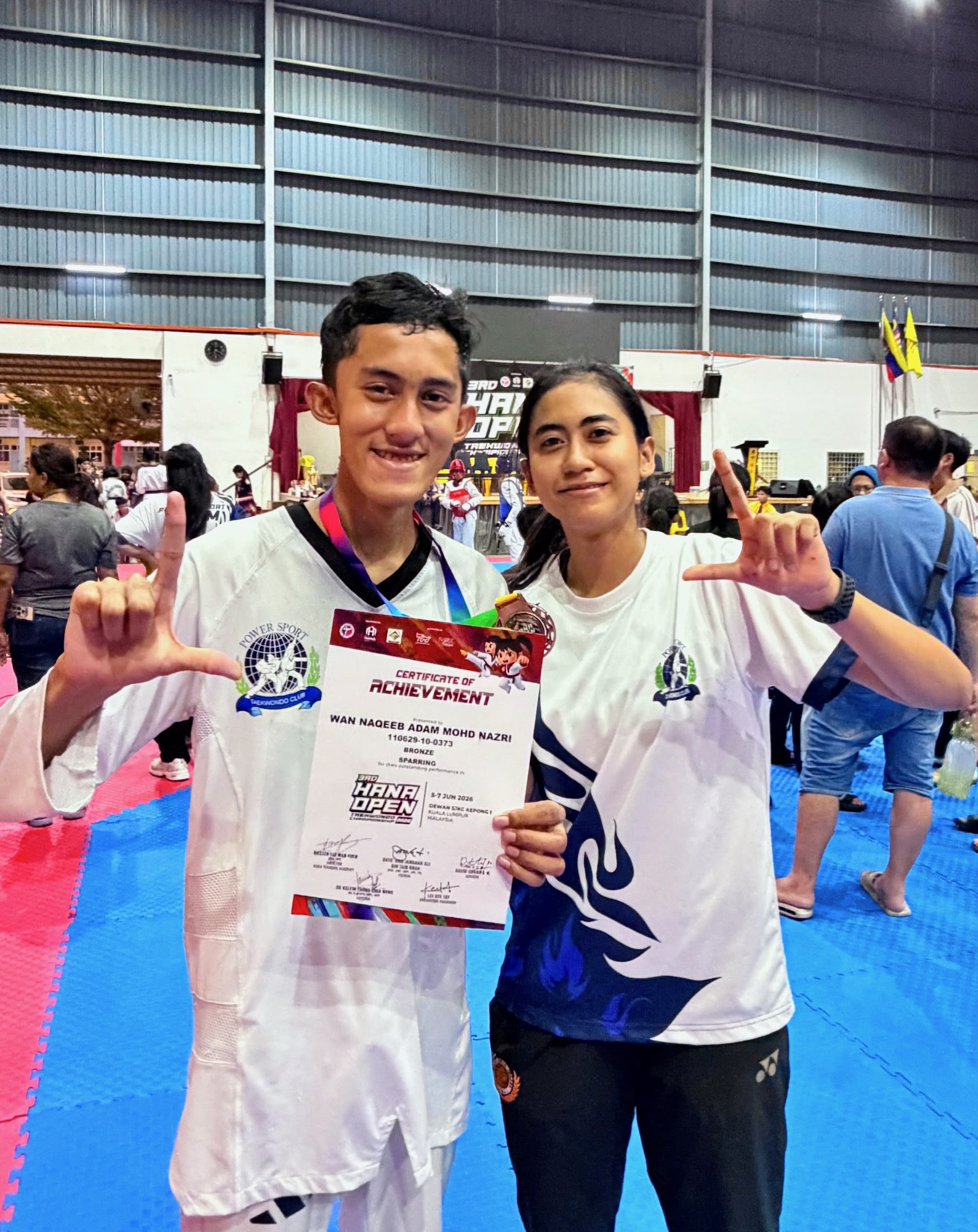 Power Sport students with a competition certificate
