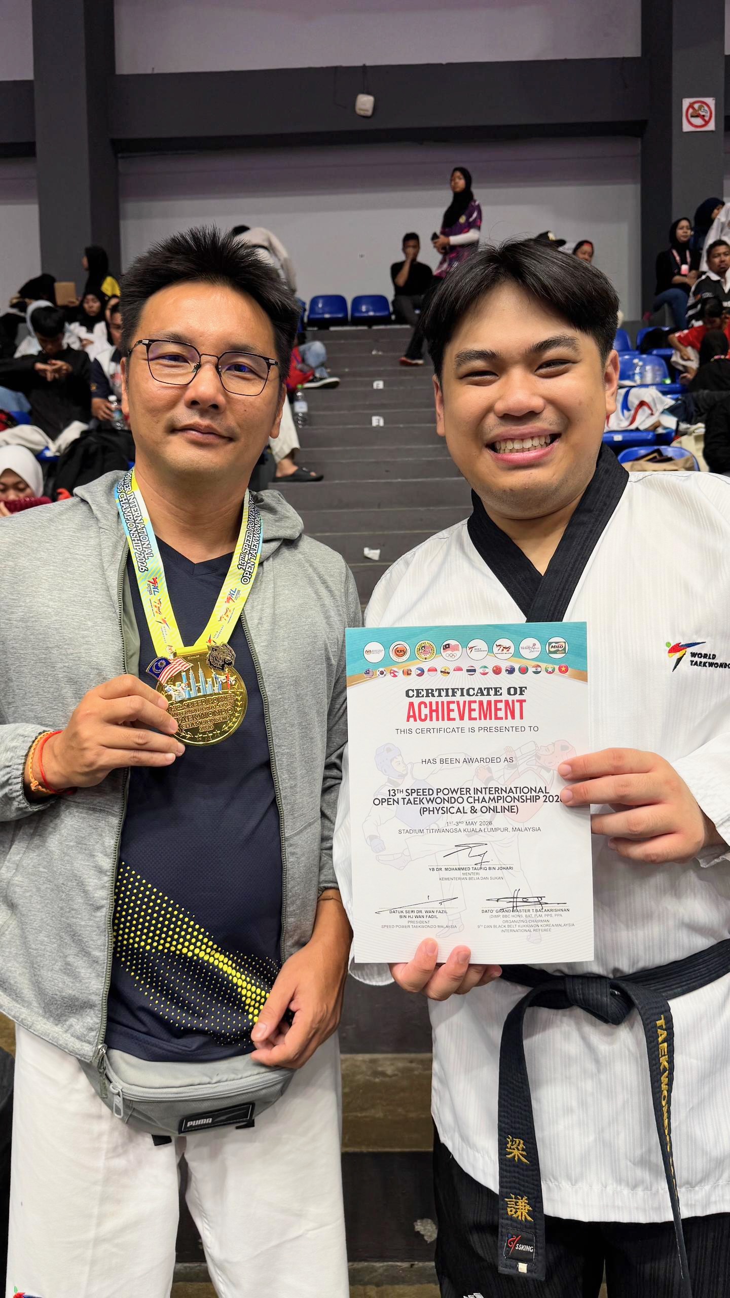 Power Sport coaches with a gold medal and certificate