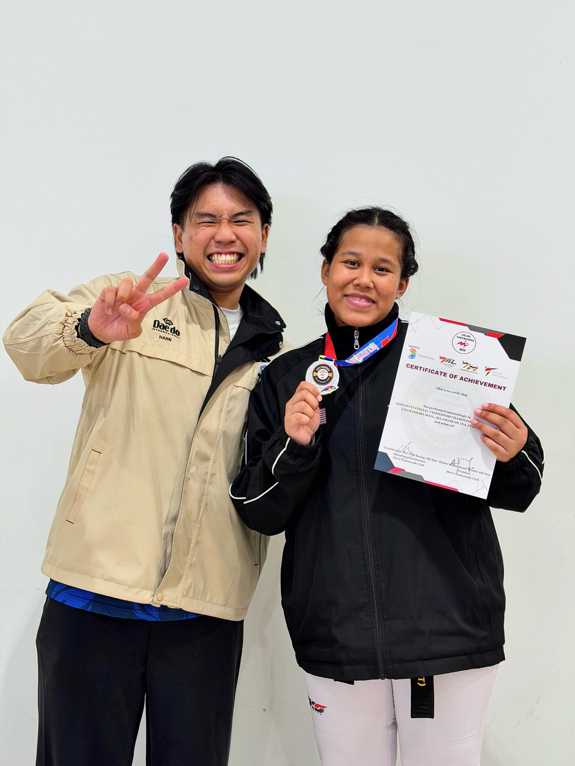 Power Sport coach and student with a medal and certificate