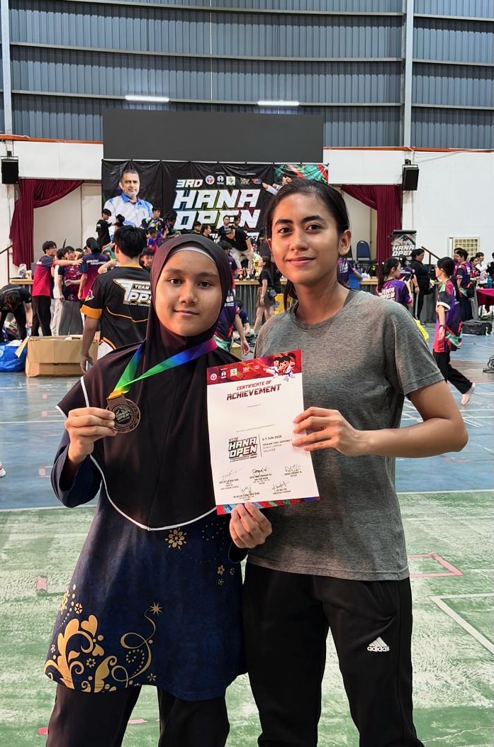 Power Sport student with a certificate of achievement