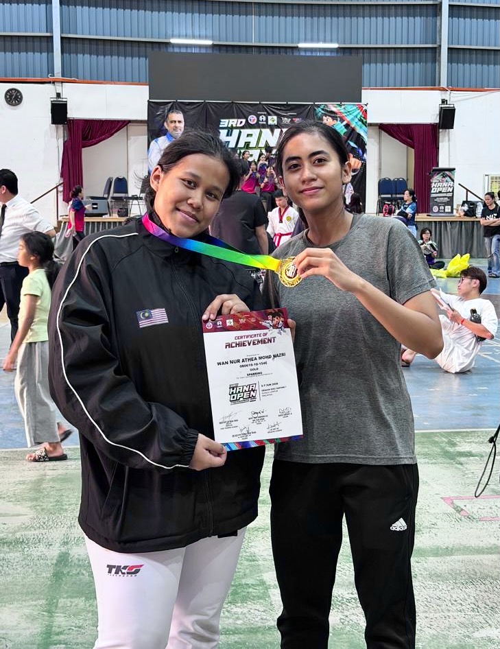 Power Sport coach and student with a gold medal certificate