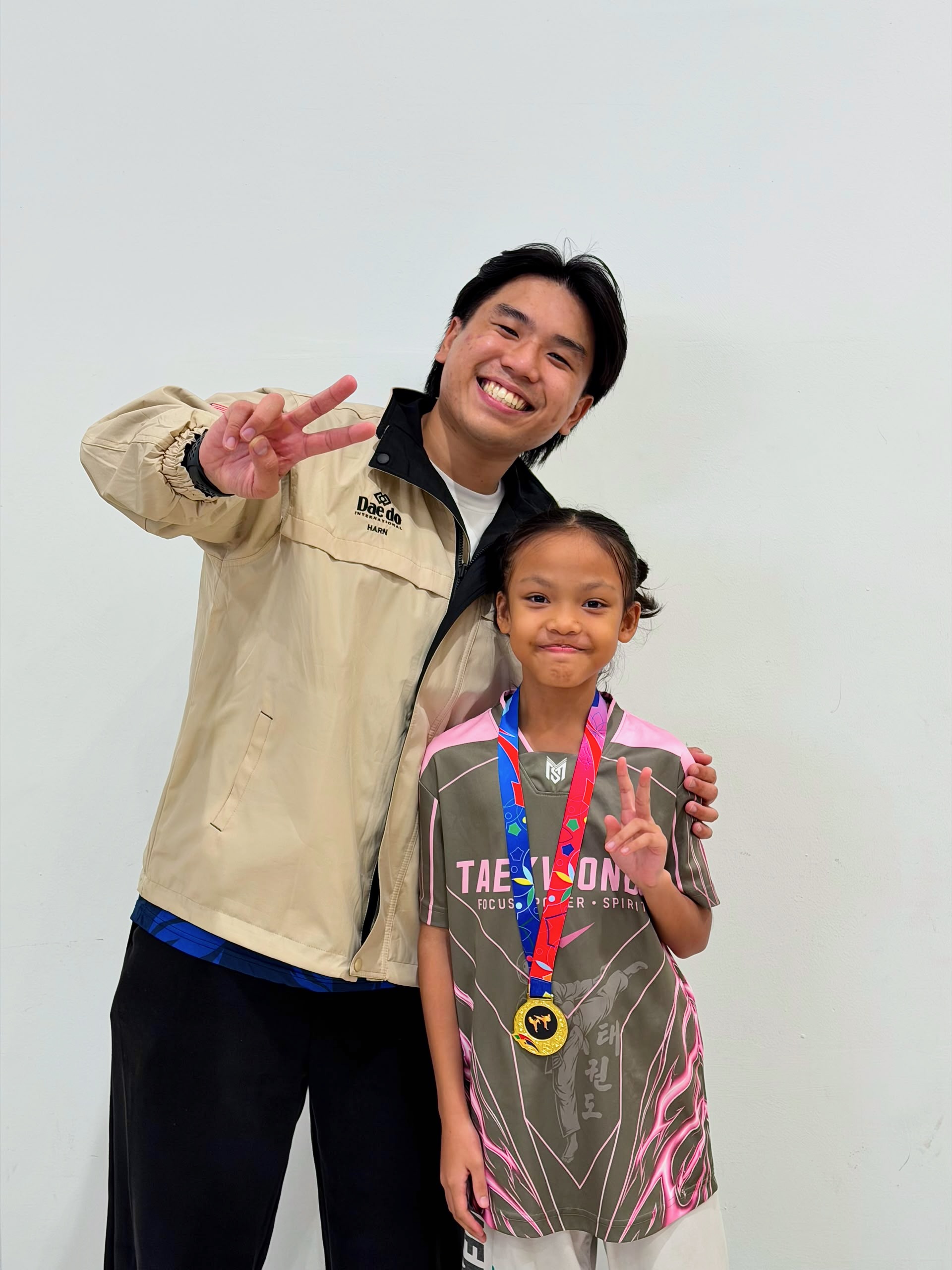 Power Sport coach and student with a gold medal