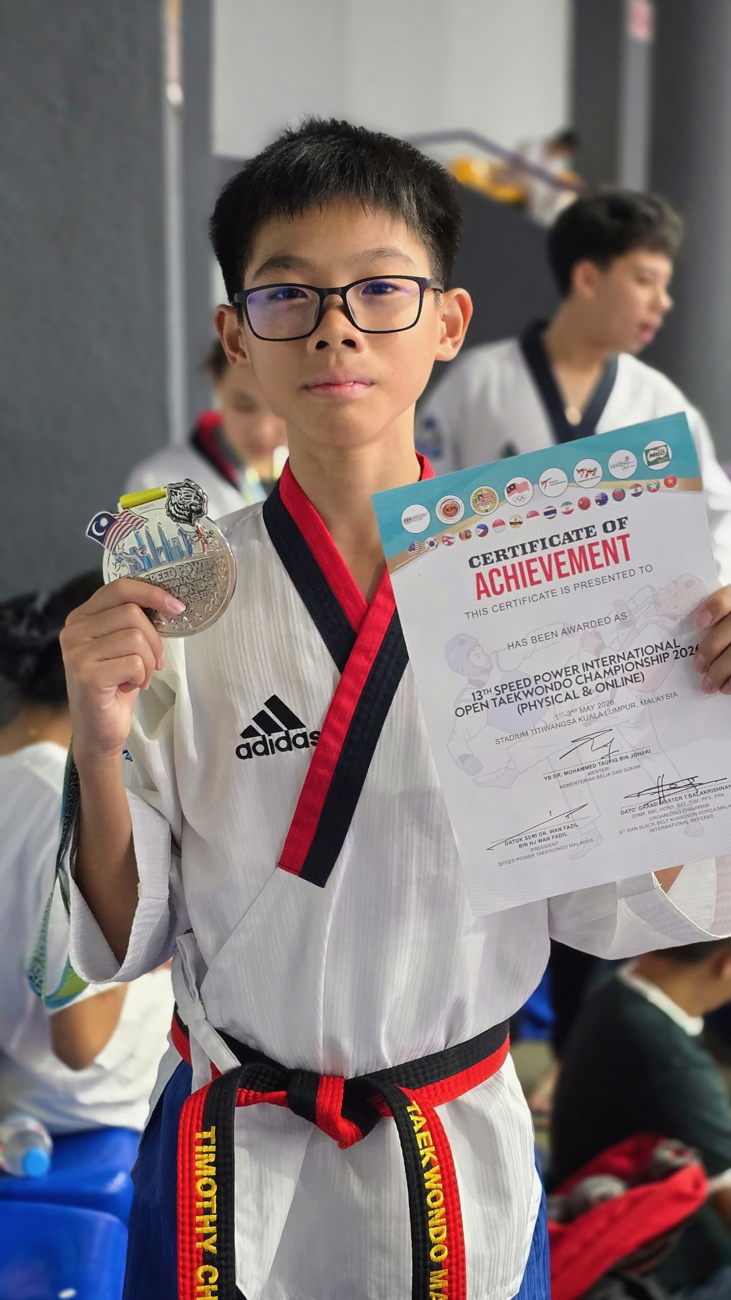 Power Sport student with a medal and certificate