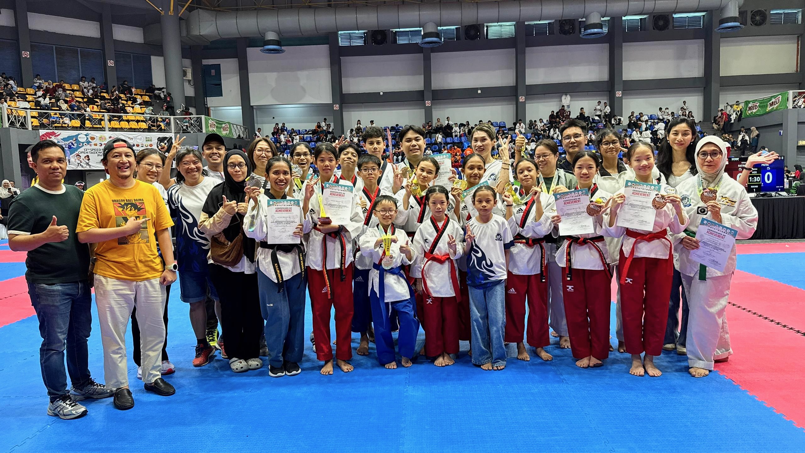 Power Sport students and coaches with certificates at a competition