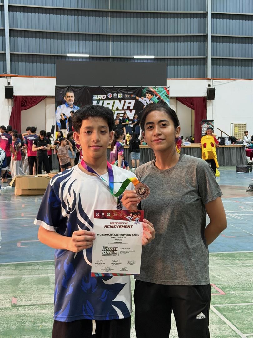 Power Sport student with a certificate and medal