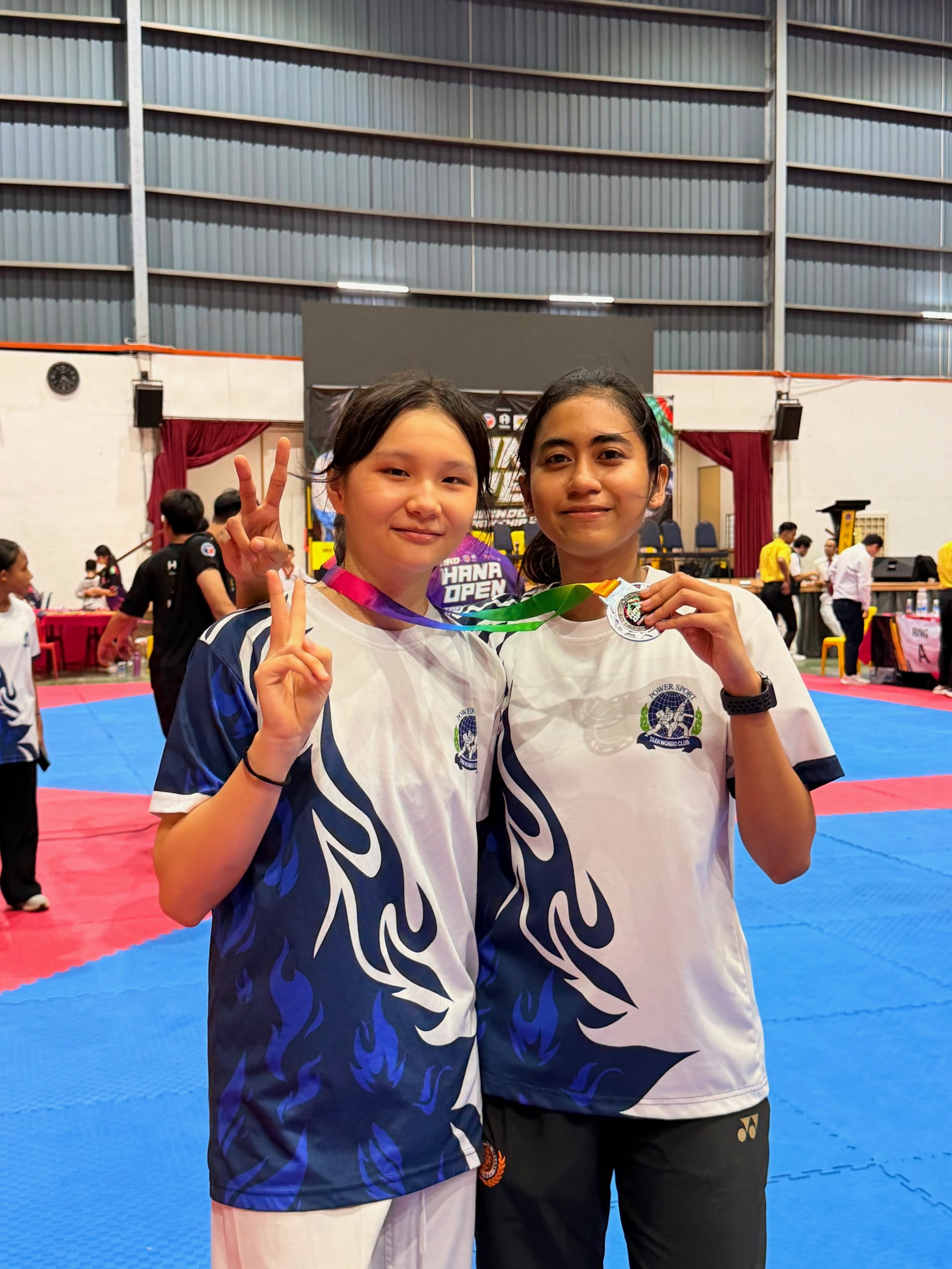 Power Sport students with a medal