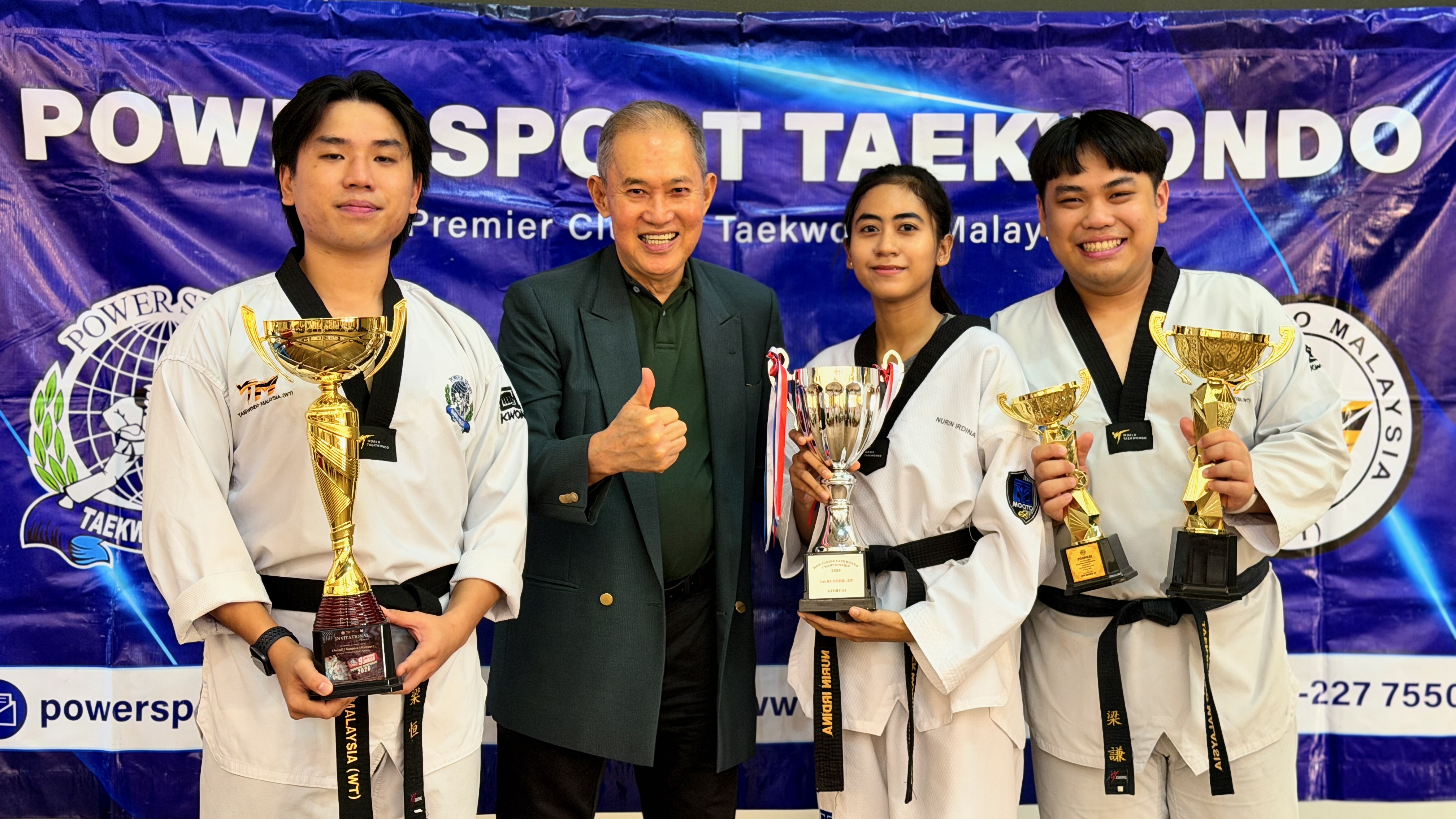 Power Sport students with trophies at the club